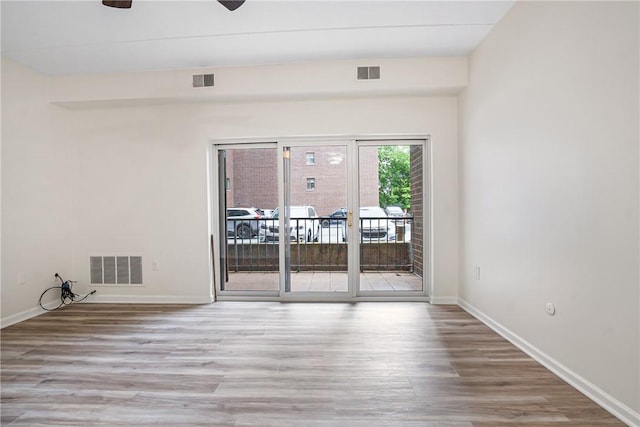 5600 Munhall Rd Unit 201, Squirrel Hill, PA 15217 - empty room featuring wood finished floors, baseboards, and a ceiling fan