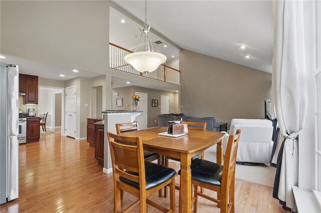 1148 Camarta Dr, Baldwin Boro, PA 15227 - dining space featuring light wood-style flooring, high vaulted ceiling, and recessed lighting