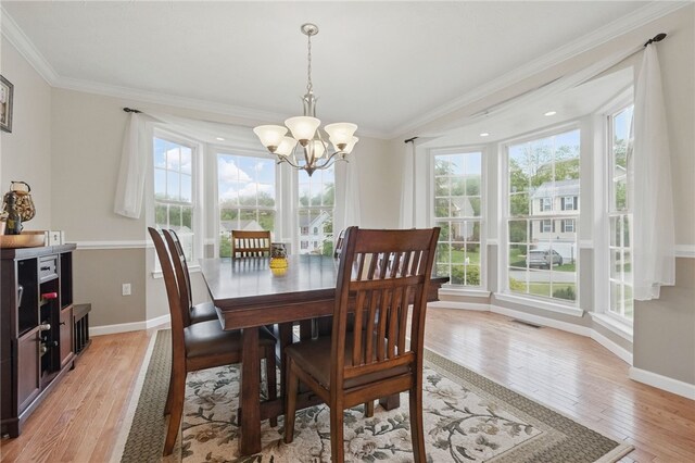 1148 Camarta Dr, Baldwin Boro, PA 15227 - dining area with a chandelier, light wood-style flooring, baseboards, and ornamental molding