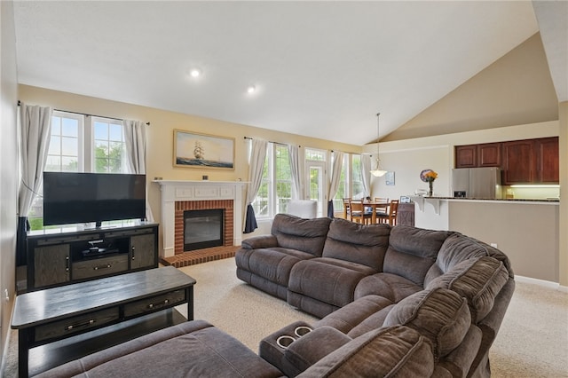 1148 Camarta Dr, Baldwin Boro, PA 15227 - living area featuring plenty of natural light, light colored carpet, a brick fireplace, high vaulted ceiling, and recessed lighting