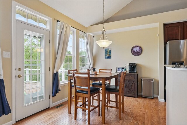 1148 Camarta Dr, Baldwin Boro, PA 15227 - dining room featuring lofted ceiling, light wood-style flooring, healthy amount of natural light, and baseboards