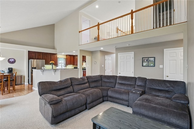1148 Camarta Dr, Baldwin Boro, PA 15227 - living area with high vaulted ceiling and light carpet