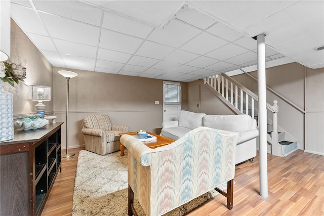 444 Tivoli Rd, Plum Boro, PA 15239 - living area featuring wood finished floors, stairs, and a drop ceiling