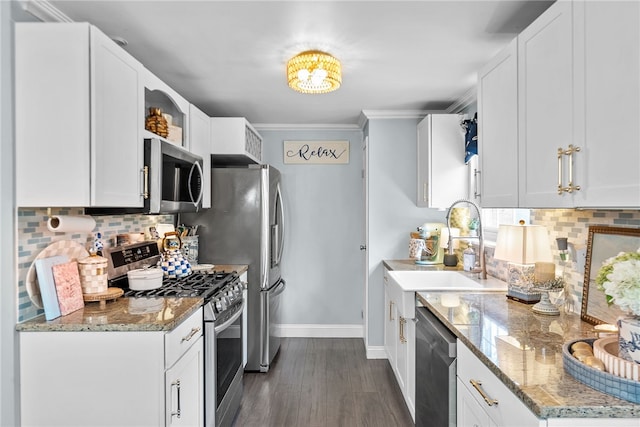 444 Tivoli Rd, Plum Boro, PA 15239 - kitchen featuring appliances with stainless steel finishes, baseboards, backsplash, dark wood finished floors, and ornamental molding