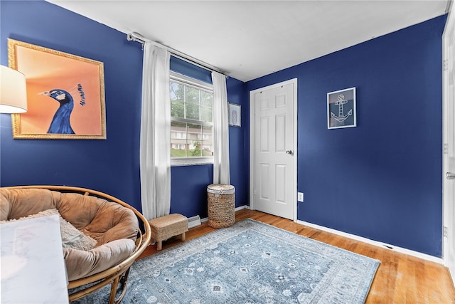 444 Tivoli Rd, Plum Boro, PA 15239 - living area featuring wood finished floors, baseboards, and baseboard heating