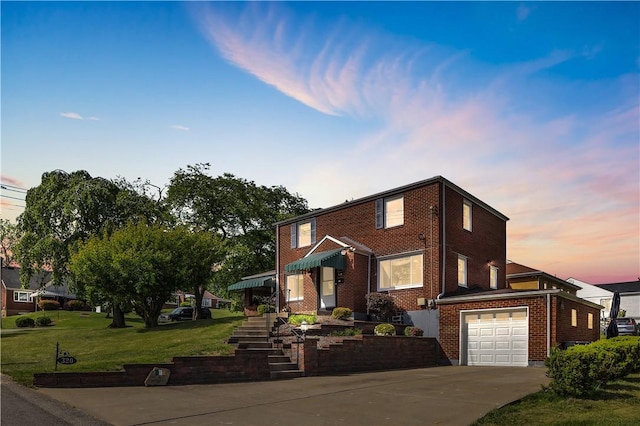 320 Pinevue Dr, Monroeville, PA 15146 - view of front of home featuring driveway, brick siding, a front yard, stairway, and a garage