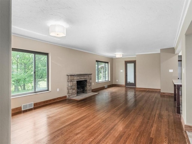 330 Center Grange Rd, Center Twp Bea, PA 15061 - unfurnished living room featuring wood finished floors, a fireplace, crown molding, baseboards, and a textured ceiling