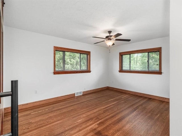 330 Center Grange Rd, Center Twp Bea, PA 15061 - unfurnished room with wood finished floors, baseboards, and a ceiling fan