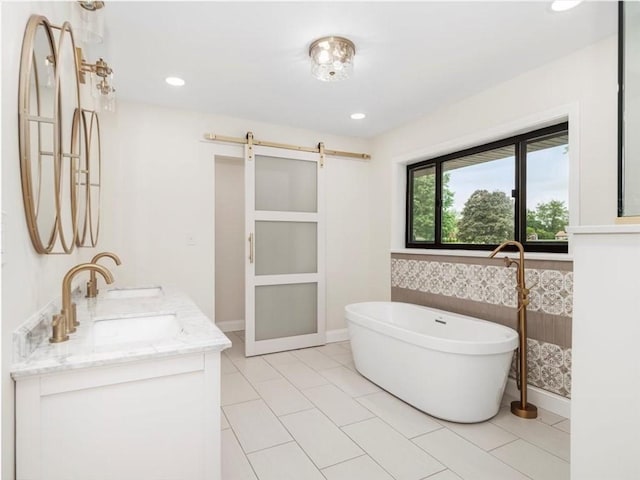 330 Center Grange Rd, Center Twp Bea, PA 15061 - full bath with a soaking tub, double vanity, baseboards, wallpapered walls, and recessed lighting