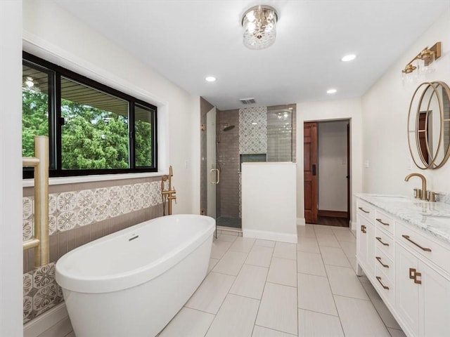 330 Center Grange Rd, Center Twp Bea, PA 15061 - bathroom with a stall shower, vanity, a freestanding bath, recessed lighting, and baseboards