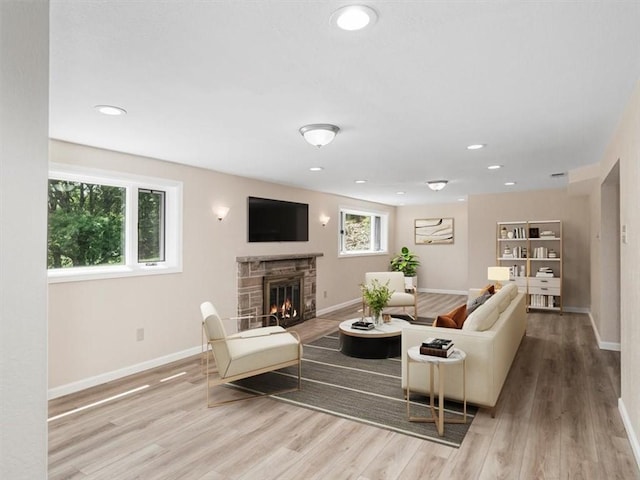 330 Center Grange Rd, Center Twp Bea, PA 15061 - living area featuring a stone fireplace, baseboards, wood finished floors, and recessed lighting