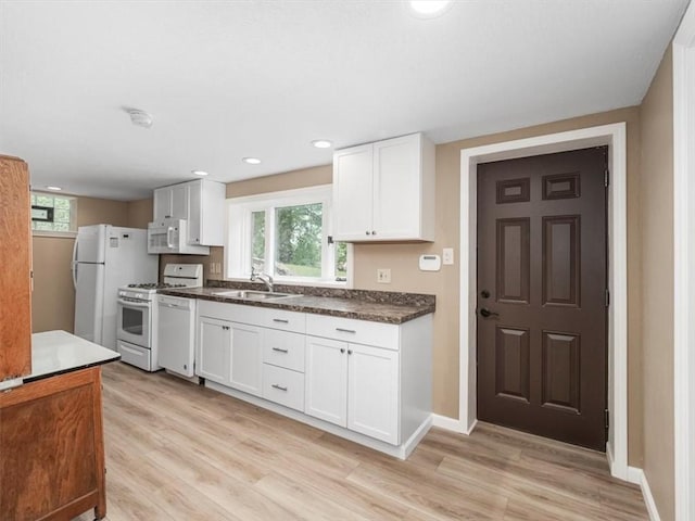330 Center Grange Rd, Center Twp Bea, PA 15061 - kitchen featuring white appliances, light wood-style flooring, white cabinetry, dark countertops, and recessed lighting