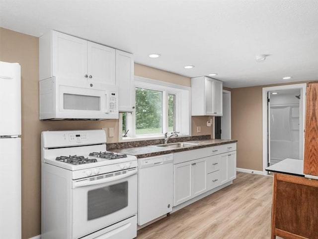 330 Center Grange Rd, Center Twp Bea, PA 15061 - kitchen with white appliances, a sink, light wood-style flooring, white cabinetry, and dark countertops