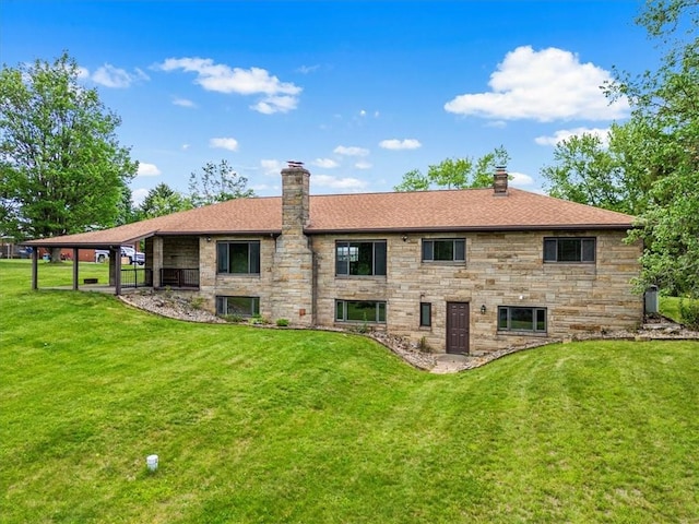 330 Center Grange Rd, Center Twp Bea, PA 15061 - rear view of house featuring a chimney, stone siding, and a lawn