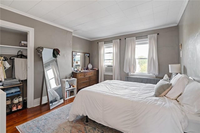 4123 Foster St, Lawrenceville, PA 15201 - bedroom with radiator, wood finished floors, ornamental molding, and cooling unit