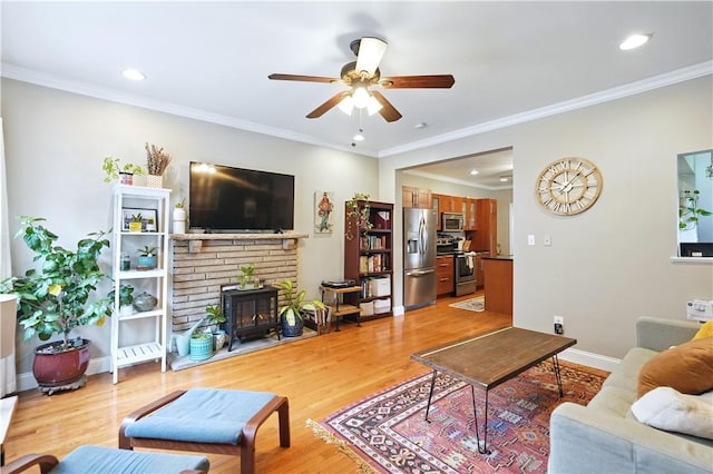 2511 Mission St, South Side, PA 15203 - living area featuring a ceiling fan, light wood-style flooring, crown molding, recessed lighting, and baseboards