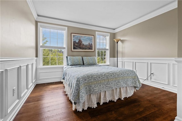 302 Pointe View Dr, Adams Twp, PA 16046 - bedroom with crown molding, dark wood-type flooring, a decorative wall, and wainscoting