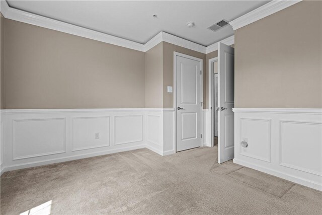 302 Pointe View Dr, Adams Twp, PA 16046 - empty room with crown molding, light carpet, a decorative wall, wainscoting, and a smoke detector