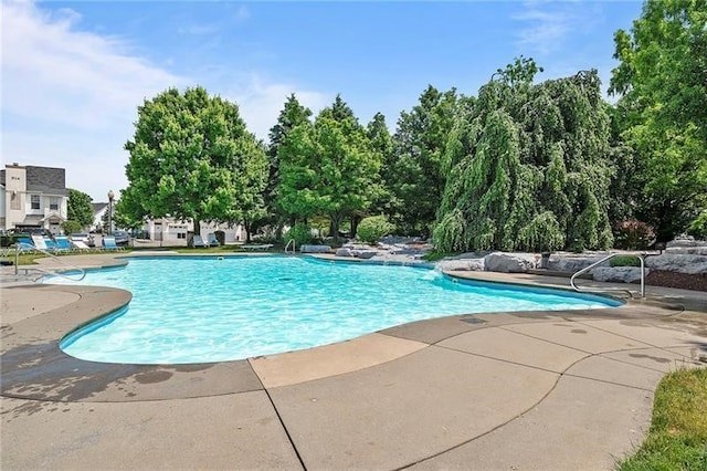 302 Pointe View Dr, Adams Twp, PA 16046 - community pool featuring a patio area and view of wooded area
