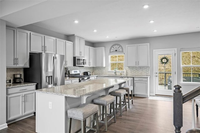 414 Greenwood Dr, North Strabane, PA 15317 - kitchen featuring stainless steel appliances, a breakfast bar, a kitchen island, recessed lighting, and dark wood-style floors