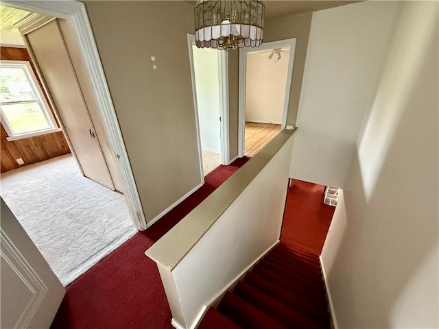 2225 Pleasantview Dr, Manor Twp, PA 16226 - stairway featuring carpet flooring, baseboards, and a chandelier