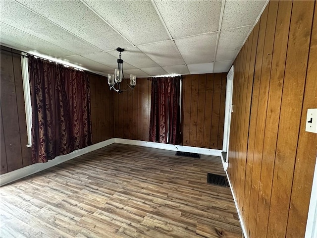 221 Friendship St, New Castle/5Th, PA 16101 - unfurnished dining area with wood walls, wood finished floors, baseboards, and a paneled ceiling