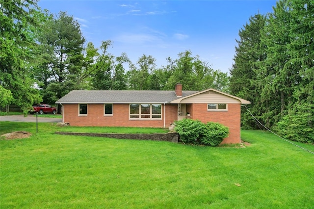 658 Bower Hill Rd, Peters Twp, PA 15367 - view of front of home with a front yard, a chimney, and brick siding