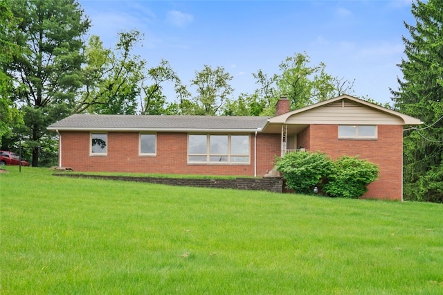 658 Bower Hill Rd, Peters Twp, PA 15367 - ranch-style house featuring brick siding, a front lawn, and a chimney
