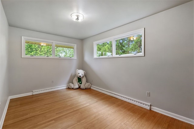 658 Bower Hill Rd, Peters Twp, PA 15367 - empty room with baseboard heating, a baseboard radiator, light wood finished floors, and baseboards