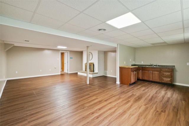 658 Bower Hill Rd, Peters Twp, PA 15367 - indoor bar featuring wood finished floors, a fireplace, a drop ceiling, and baseboards