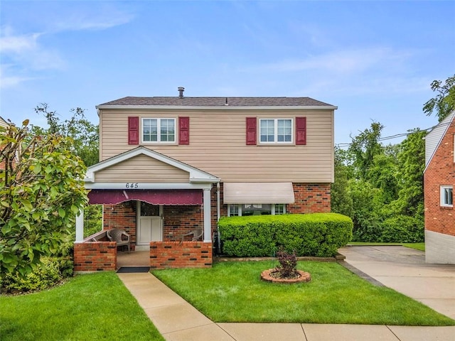 645 Dewalt Dr, Baldwin Twp, PA 15234 - view of front facade with brick siding and a front lawn