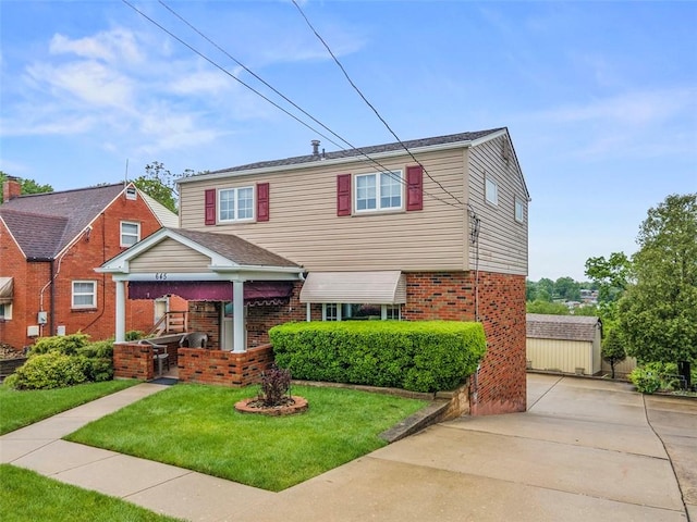 645 Dewalt Dr, Baldwin Twp, PA 15234 - view of front of house featuring brick siding and a front lawn