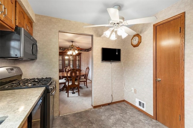645 Dewalt Dr, Baldwin Twp, PA 15234 - kitchen with black microwave, stainless steel range with gas cooktop, a ceiling fan, brown cabinets, and light countertops