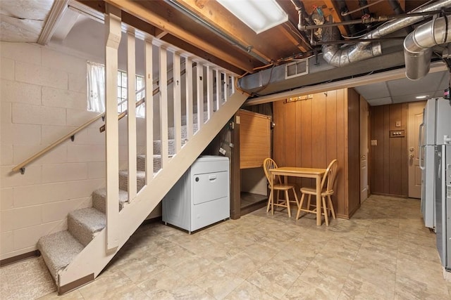 645 Dewalt Dr, Baldwin Twp, PA 15234 - basement featuring stairway, concrete block wall, and fridge