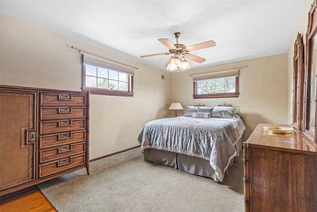 645 Dewalt Dr, Baldwin Twp, PA 15234 - carpeted bedroom with multiple windows, baseboards, and ceiling fan