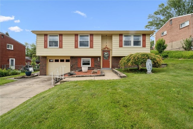 422 Mower Dr, Plum Boro, PA 15239 - bi-level home with concrete driveway, an attached garage, a front yard, and brick siding