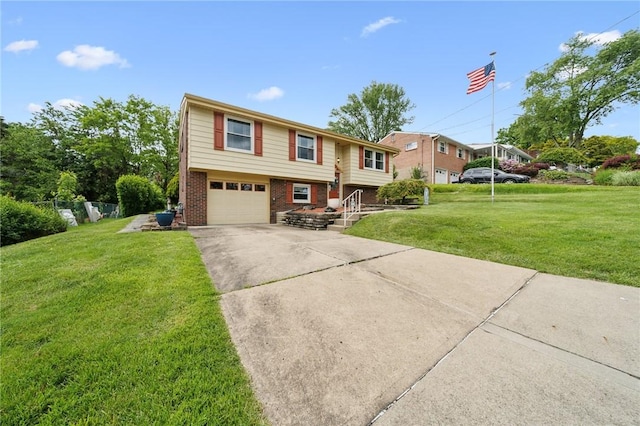 422 Mower Dr, Plum Boro, PA 15239 - split foyer home with brick siding, an attached garage, concrete driveway, and a front lawn