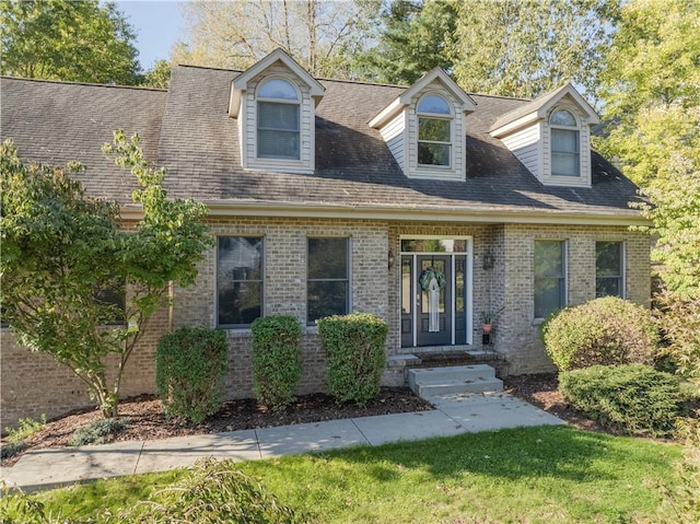 122 Hunter Dr, Cranberry Twp, PA 16066 - new england style home featuring brick siding and roof with shingles
