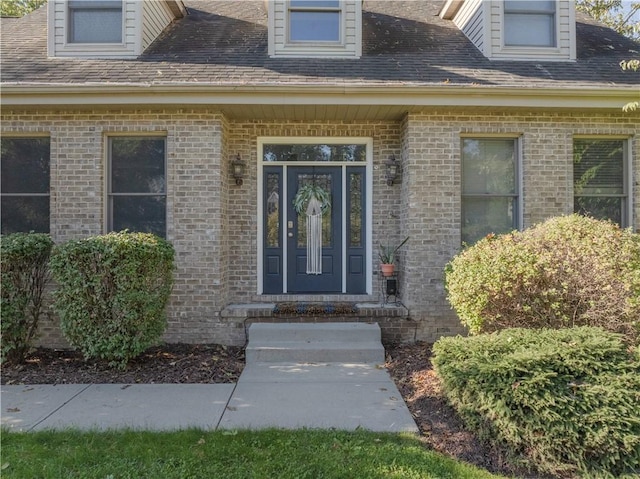 122 Hunter Dr, Cranberry Twp, PA 16066 - doorway to property featuring brick siding and roof with shingles