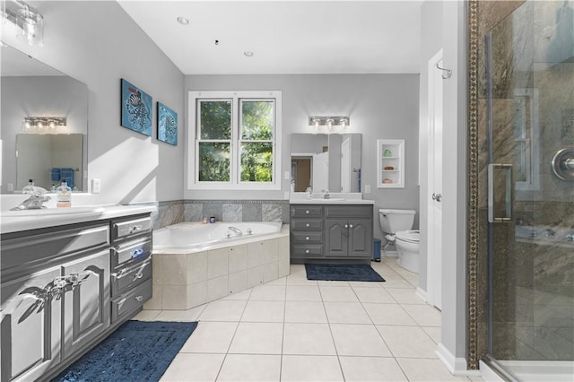 122 Hunter Dr, Cranberry Twp, PA 16066 - full bathroom with two vanities, a bath, a shower stall, and tile patterned floors
