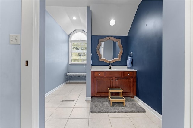 122 Hunter Dr, Cranberry Twp, PA 16066 - bathroom featuring vaulted ceiling, vanity, tile patterned flooring, baseboards, and a tub