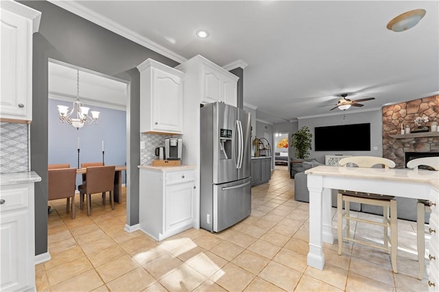 122 Hunter Dr, Cranberry Twp, PA 16066 - kitchen featuring stainless steel fridge, crown molding, open floor plan, ceiling fan, and backsplash