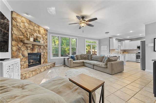 122 Hunter Dr, Cranberry Twp, PA 16066 - living room with light tile patterned floors, crown molding, ceiling fan, a fireplace, and recessed lighting