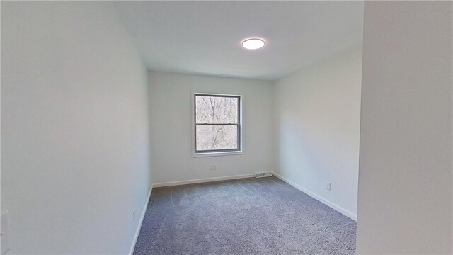 373 Cherokee Dr, Chippewa Twp, PA 15010 - unfurnished room featuring dark carpet and baseboards