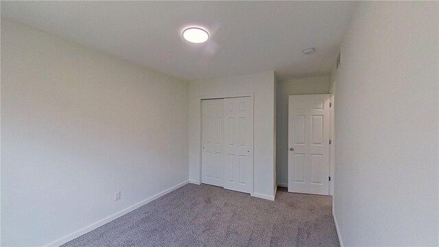373 Cherokee Dr, Chippewa Twp, PA 15010 - unfurnished bedroom with carpet floors, baseboards, and a closet