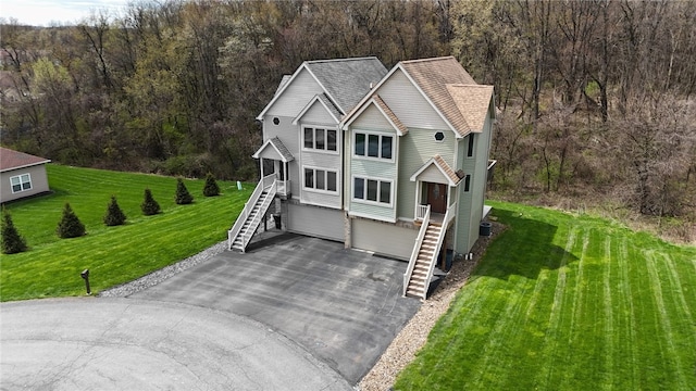 373 Cherokee Dr, Chippewa Twp, PA 15010 - view of front of home featuring stairs, driveway, and a view of trees