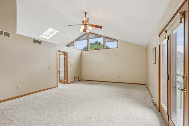 4701 Logan Ferry Rd, Murrysville, PA 15668 - spare room featuring a skylight, ceiling fan, light carpet, lofted ceiling, and baseboards