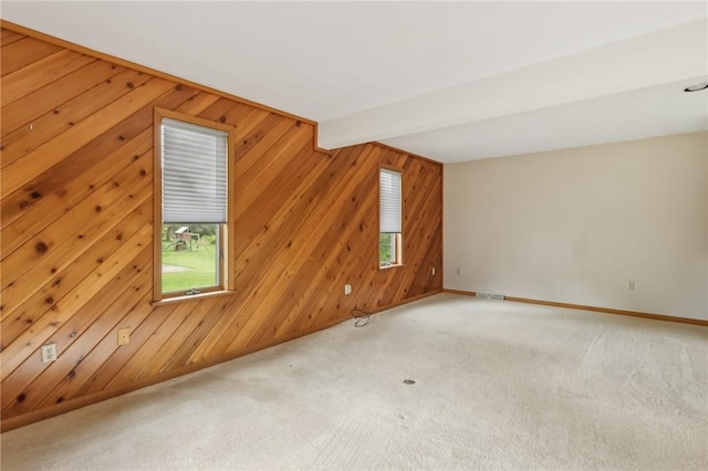 4701 Logan Ferry Rd, Murrysville, PA 15668 - spare room with plenty of natural light, light colored carpet, wood walls, and baseboards