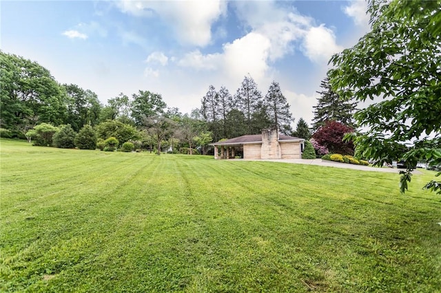 240 Connellsville St, Dunbar, PA 15431 - view of green lawn with a detached garage