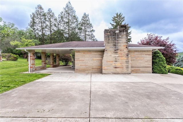 240 Connellsville St, Dunbar, PA 15431 - view of property's community with a lawn, concrete driveway, and an attached carport